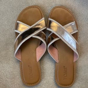 Excellent condition TOMS rose gold slides.  Womens size 8.